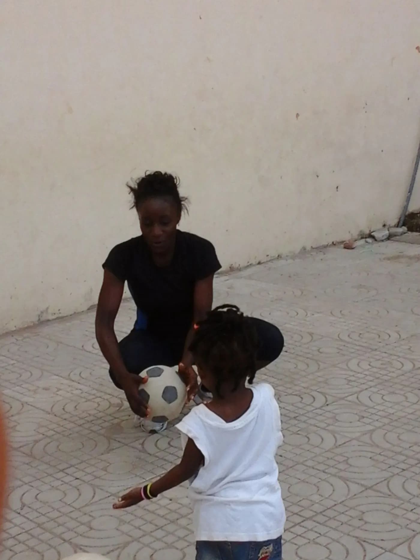 A football, and a much smaller player · Accra, 5 April 2014
