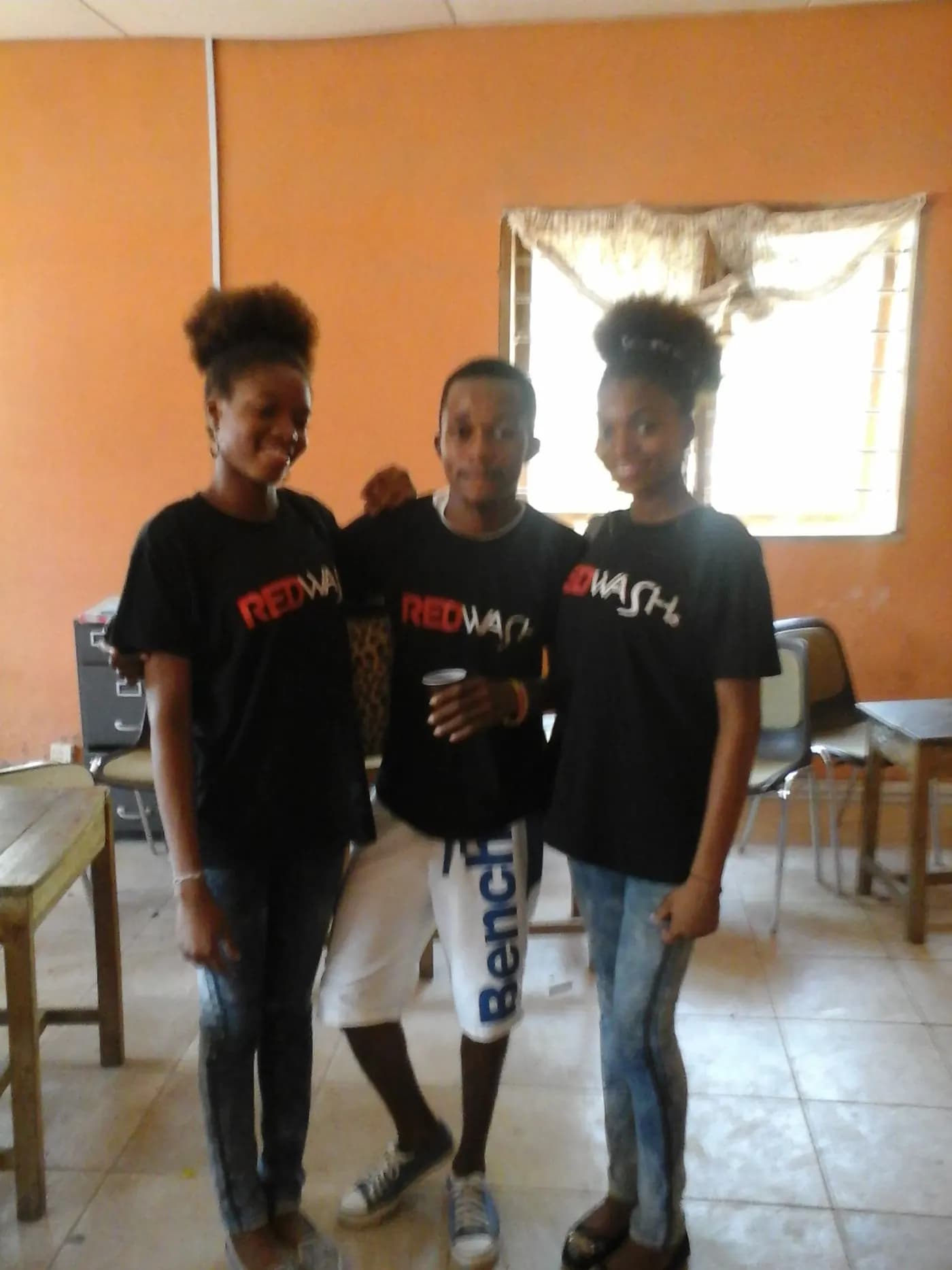Three of the team, in branded shirts · Accra, 5 April 2014