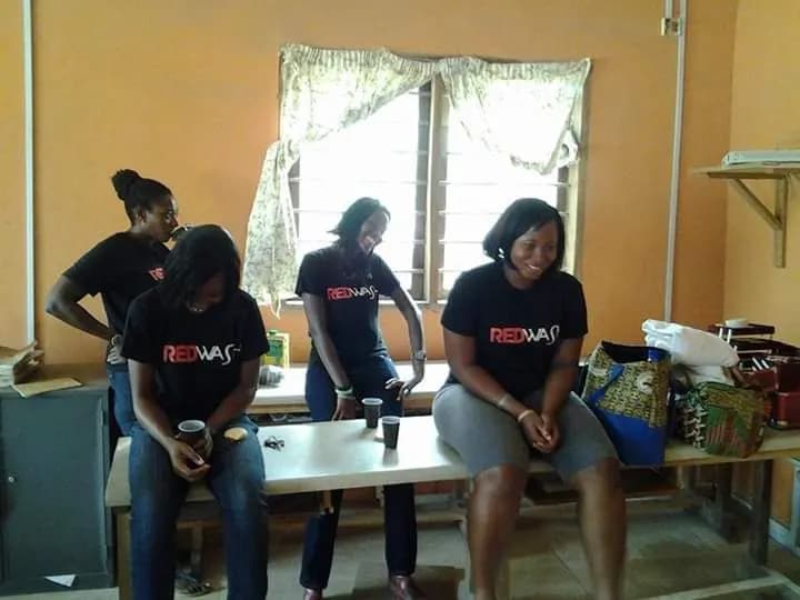 Volunteers on a bench, session over · Accra